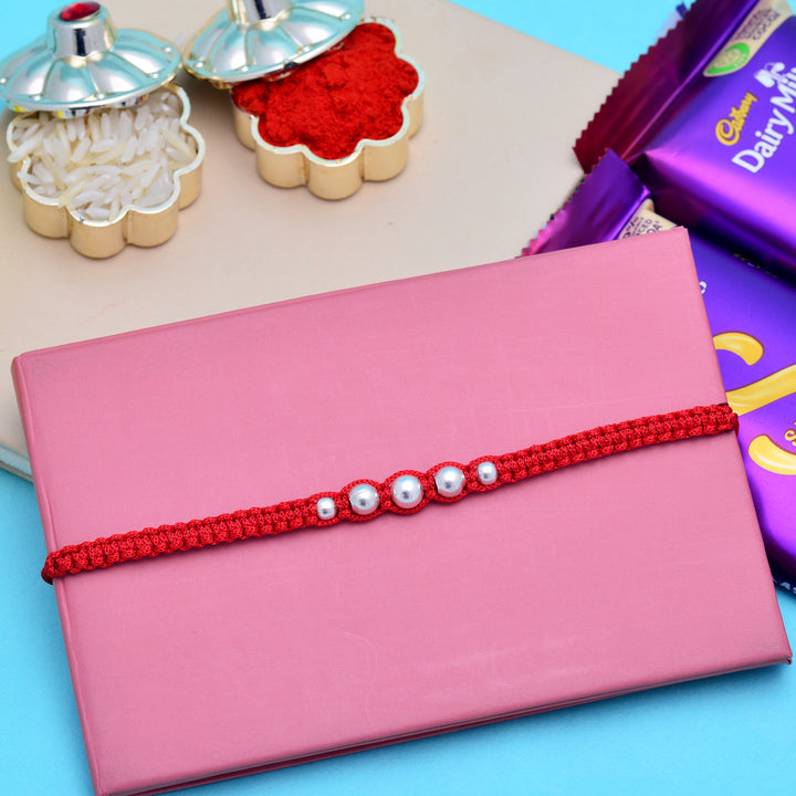 Red Thread Silver Pearl Rakhi With Dairy Milk